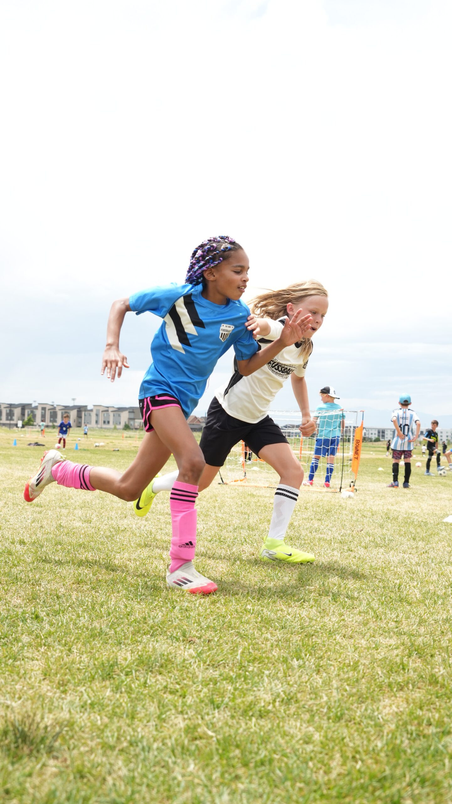 Youth soccer players sprinting during speed and agility training